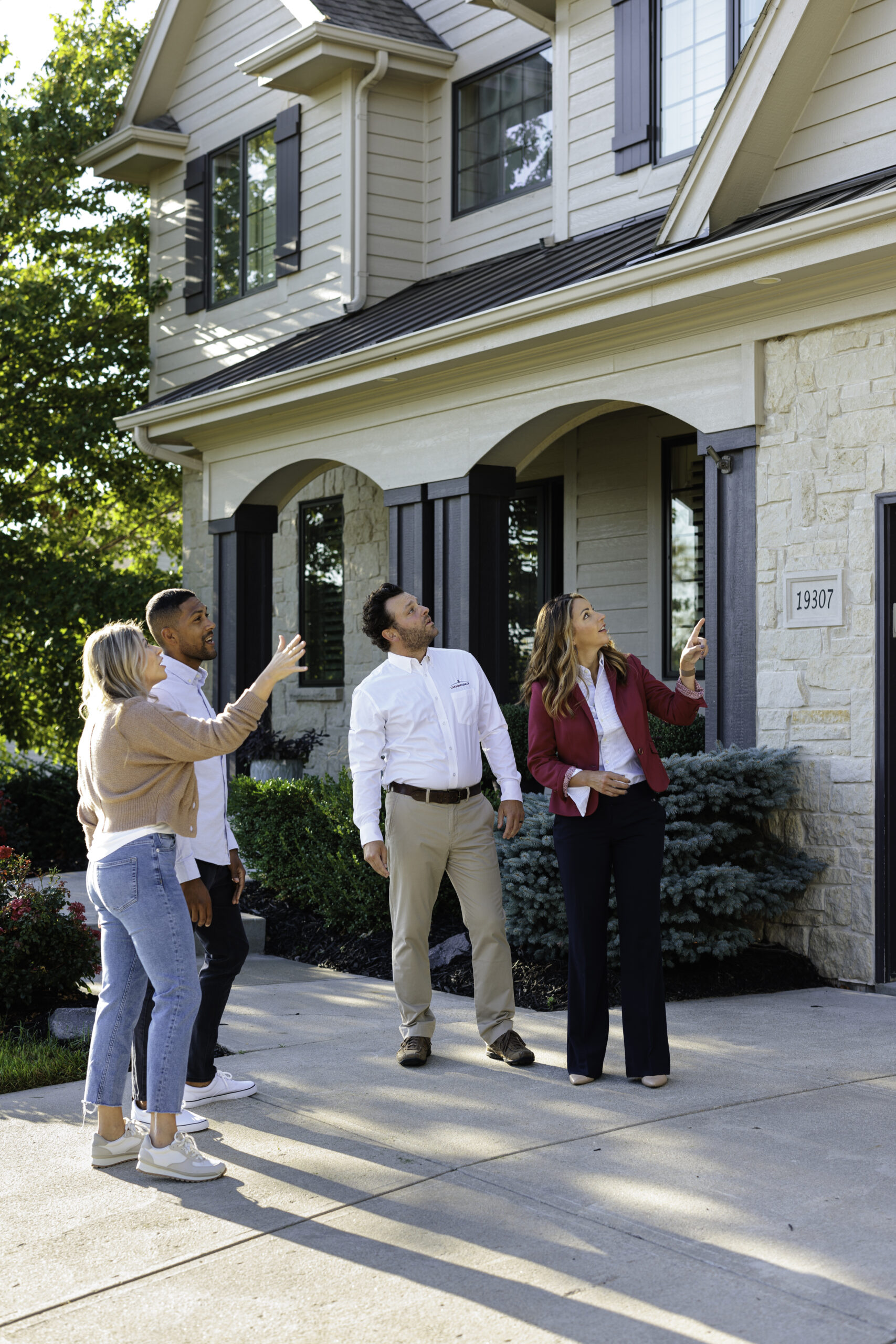 Carson Dunlop home inspector reviewing a property with a homeowner