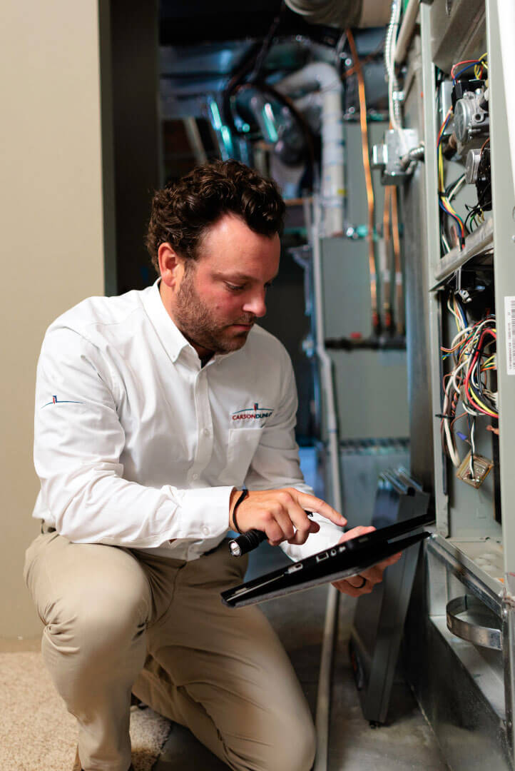 Inspector and homeowners sitting down and reviewing inspection results on tablet
